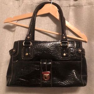 Black snakeskin bag with metal accents